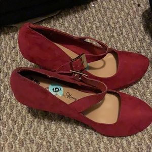 Red suede heels with buckle